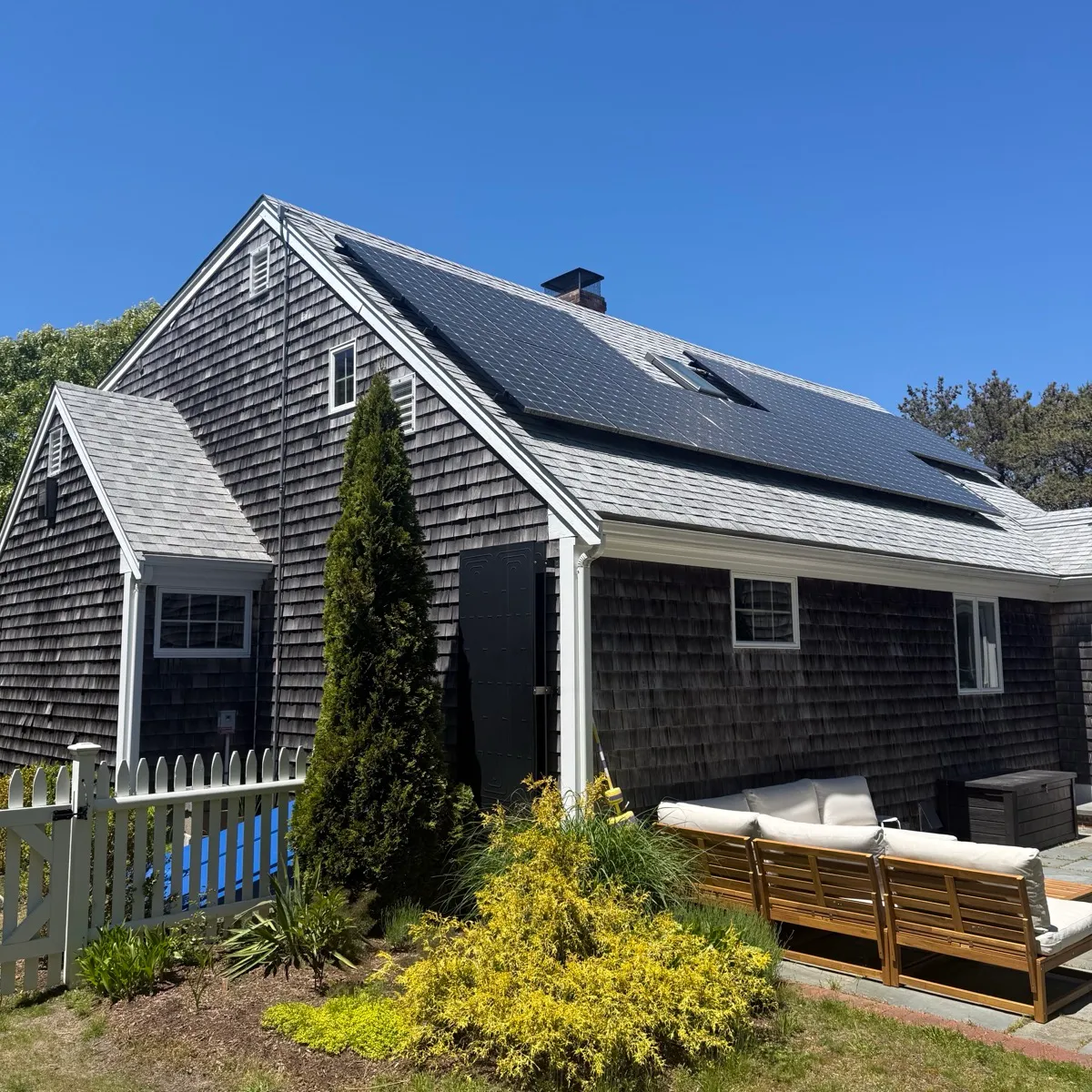 Cape Cod house with rooftop solar panels